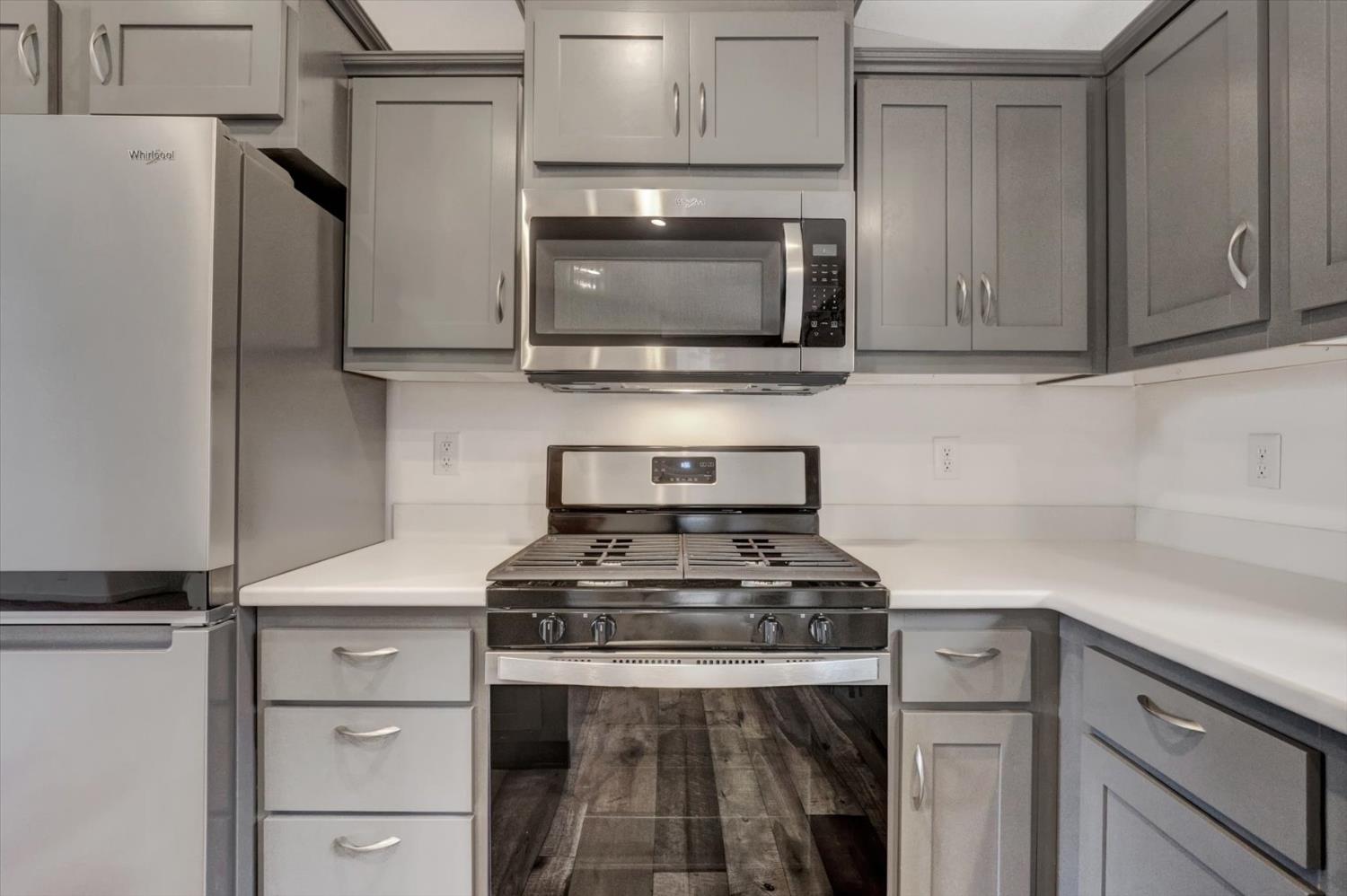 11195 Alpine Lane Grass Valley, CA 95945 - Photo 14 of 71 a kitchen with stainless steel appliances a stove and a microwave