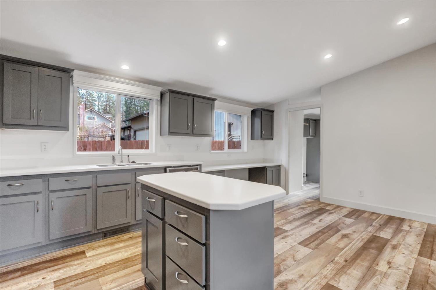 11195 Alpine Lane Grass Valley, CA 95945 - Photo 17 of 71 a kitchen with a sink stove and cabinets