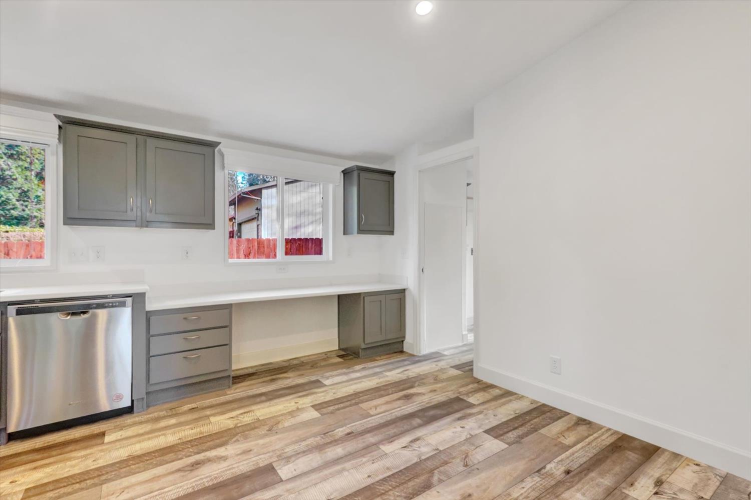 11195 Alpine Lane Grass Valley, CA 95945 - Photo 21 of 71 a view of a kitchen with a sink cabinets and a window