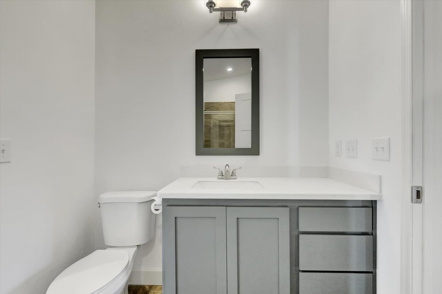 11195 Alpine Lane Grass Valley, CA 95945 - Photo 27 of 71 a bathroom with a toilet sink and mirror