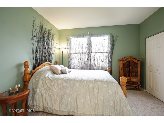 1150 Ridgewood Circle Lake In The Hills, IL 60156 - Photo 16 of 20 a bedroom with a bed and a closet