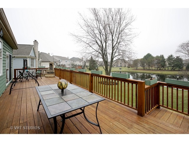 1150 Ridgewood Circle Lake In The Hills, IL 60156 - Photo 18 of 20 a view of a patio with wooden floor
