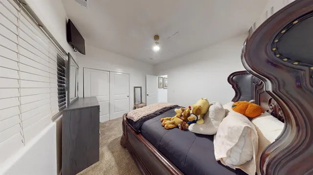 a living room with furniture and a mirror