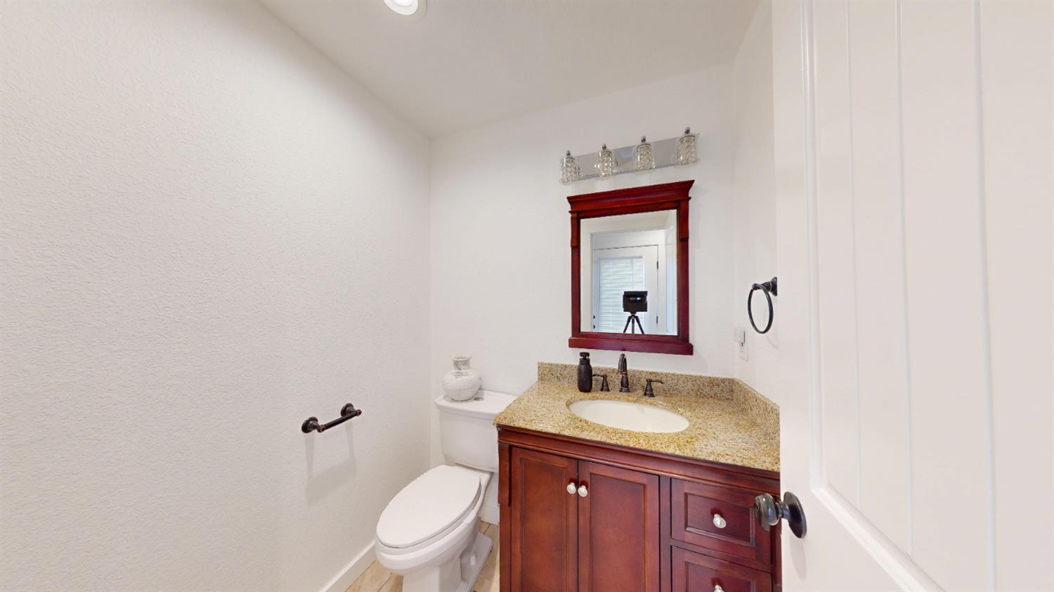 4460 South Carpenter Road Modesto, CA 95358 - Photo 18 of 40 a bathroom with a granite countertop sink toilet and mirror