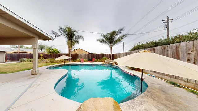 a swimming pool with yard