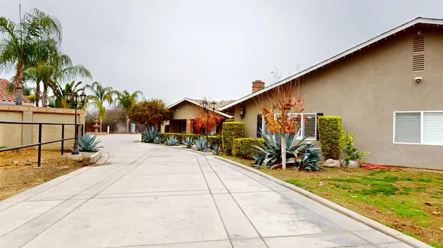 a front view of a house with basket ball court