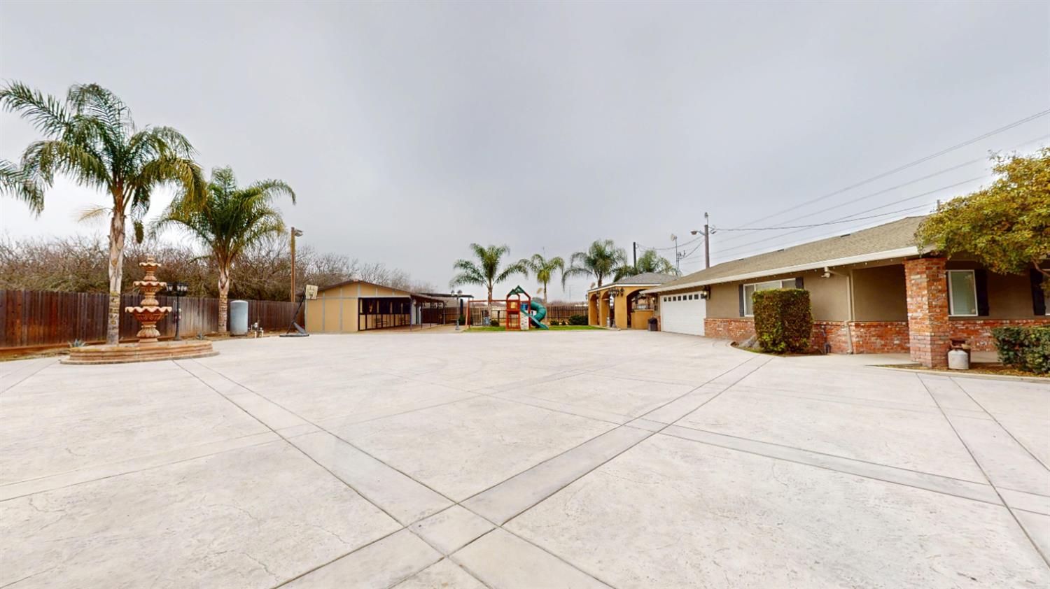 4460 South Carpenter Road Modesto, CA 95358 - Photo 31 of 40 a view of a house with a yard and a garage