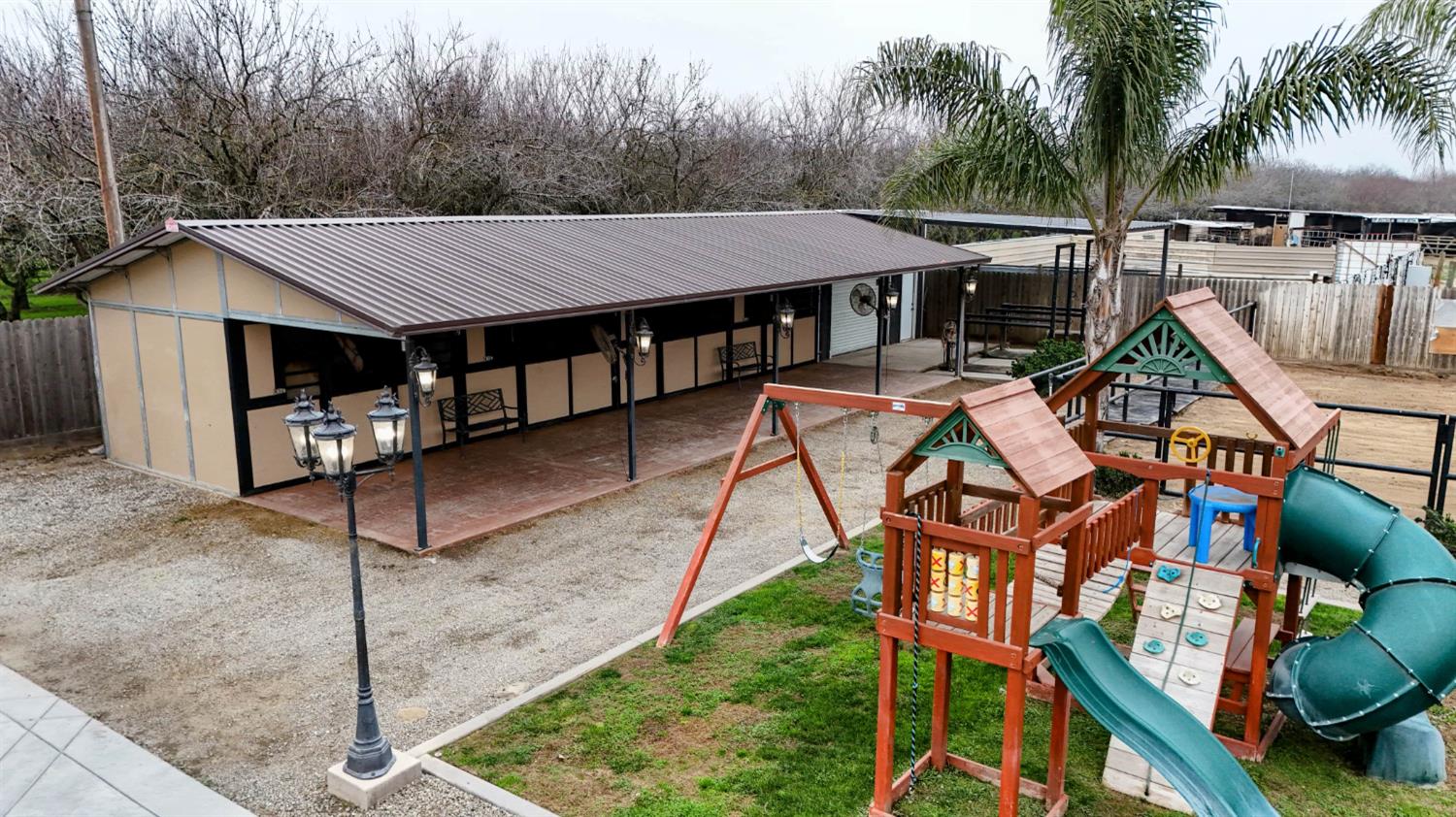 4460 South Carpenter Road Modesto, CA 95358 - Photo 39 of 40 a roof deck with table and chairs under an umbrella