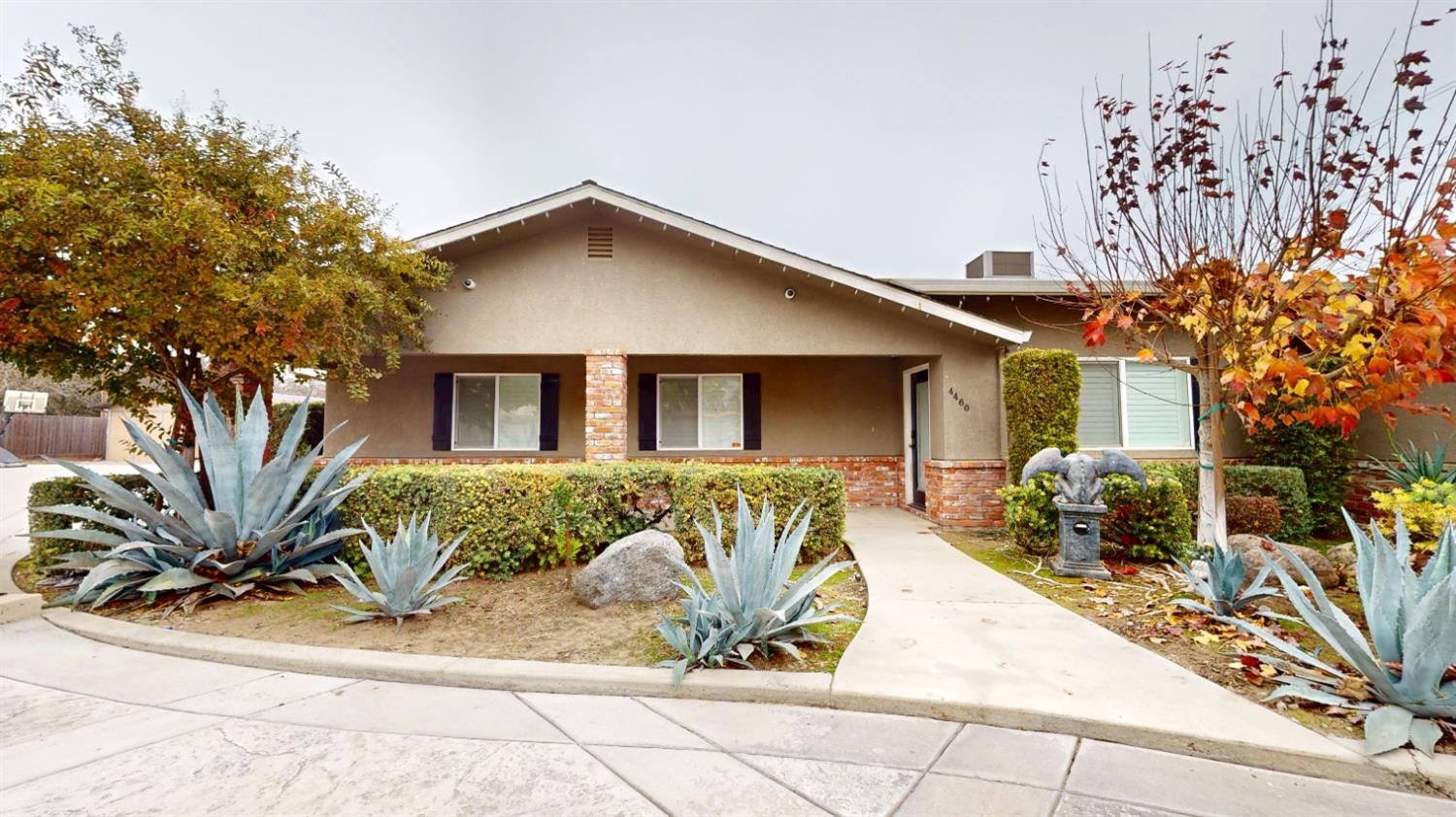 4460 South Carpenter Road Modesto, CA 95358 - Photo 4 of 40 a front view of a house with garden
