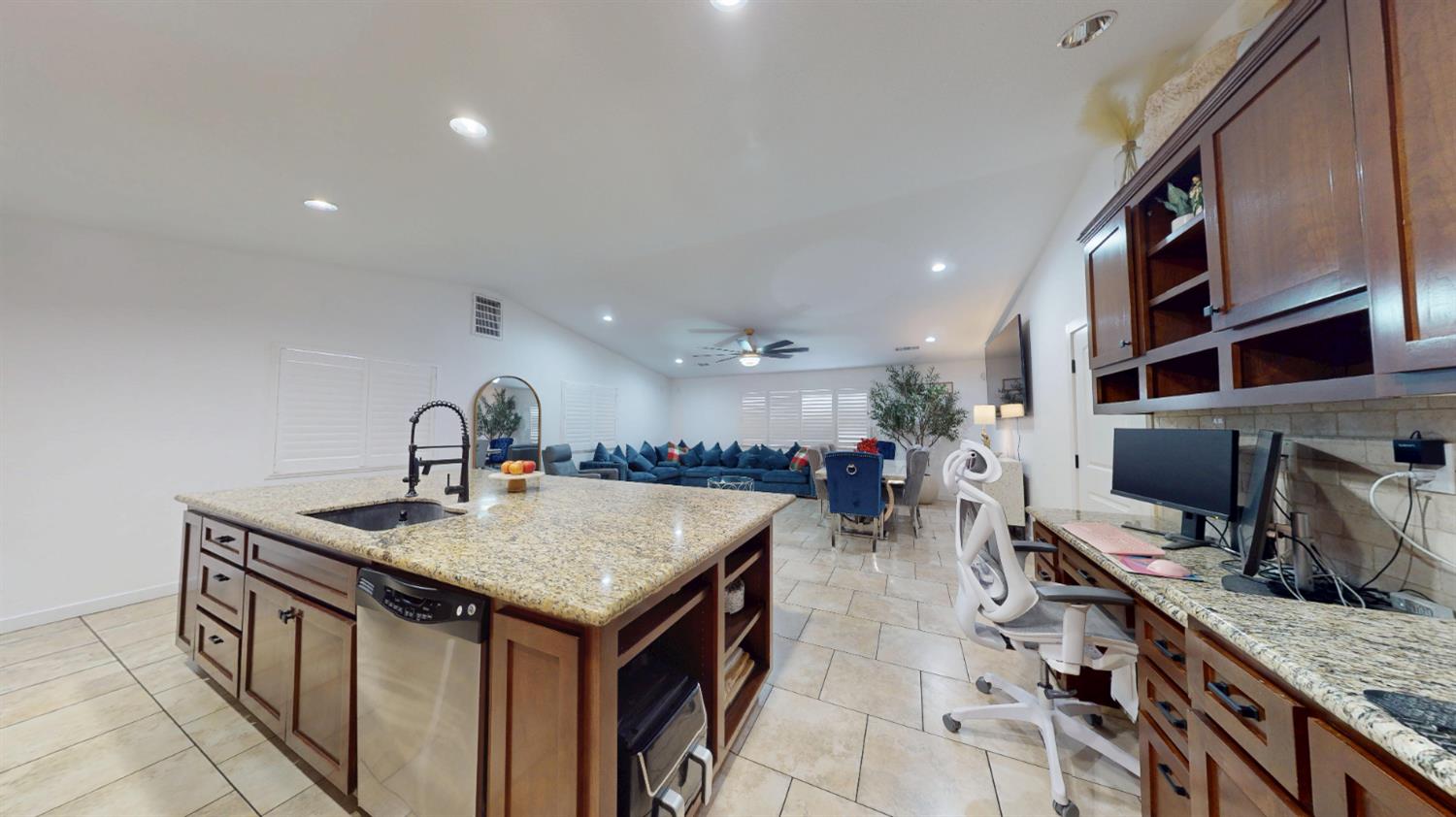 4460 South Carpenter Road Modesto, CA 95358 - Photo 9 of 40 a kitchen with a stove and a wooden floor