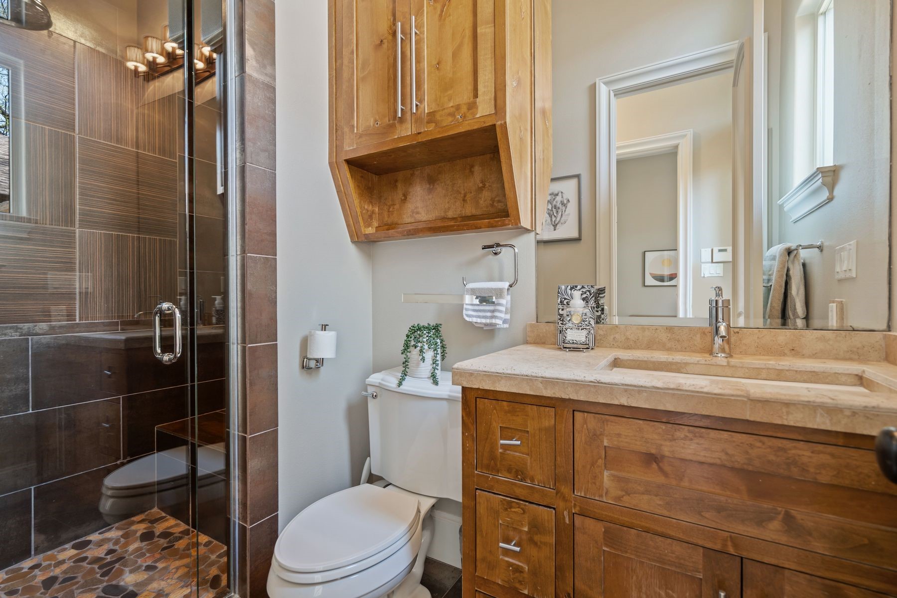 2002 Kinney Avenue, Unit B Austin, TX 78704 - Photo 24 of 34 The second guest bathroom boasts a sizable walk-in shower, offering convenience and comfort for guests during their stay.