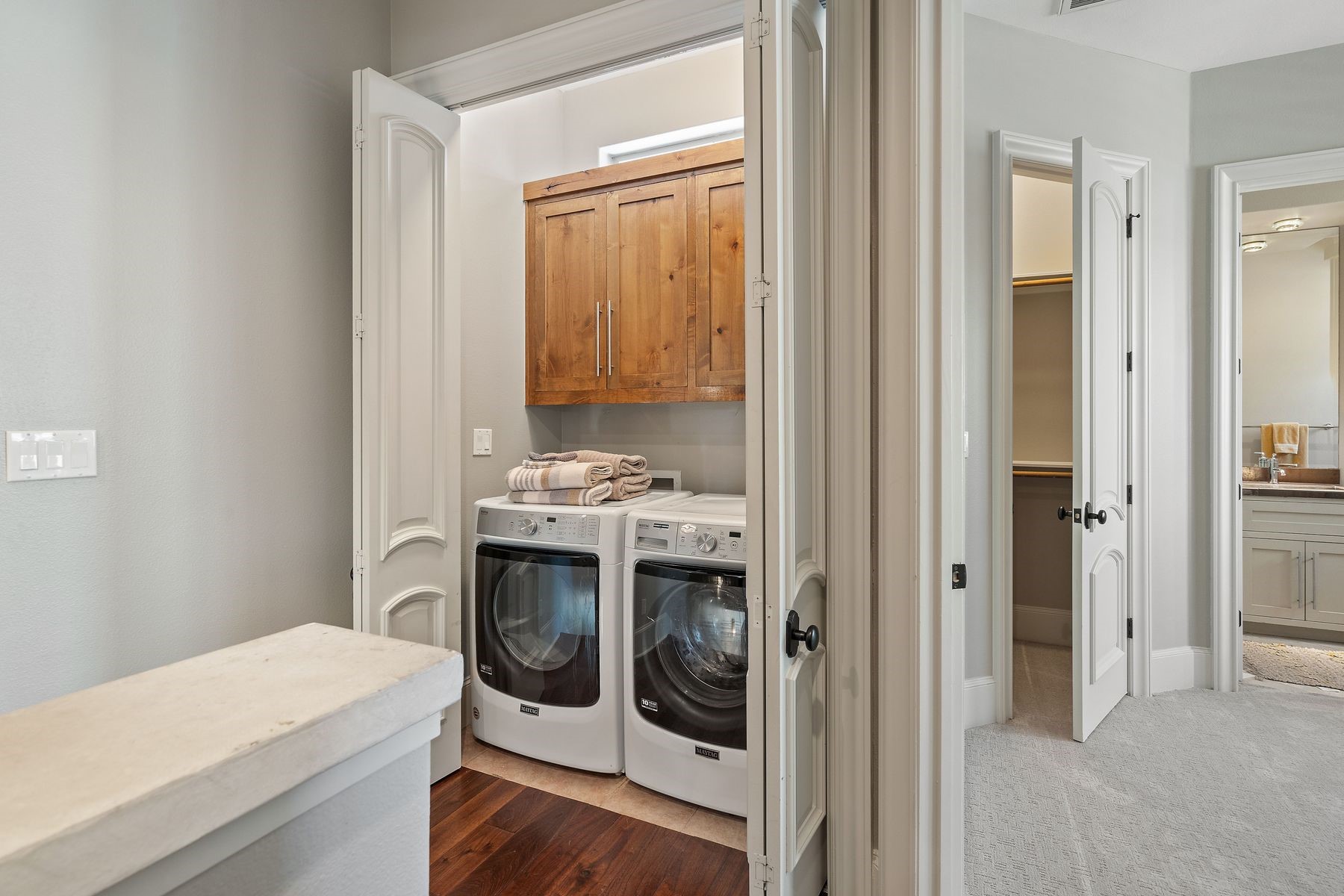 2002 Kinney Avenue, Unit B Austin, TX 78704 - Photo 28 of 34 Concealed behind closed doors, a dedicated washer and dryer room ensures seamless functionality while maintaining the aesthetic appeal of the space.