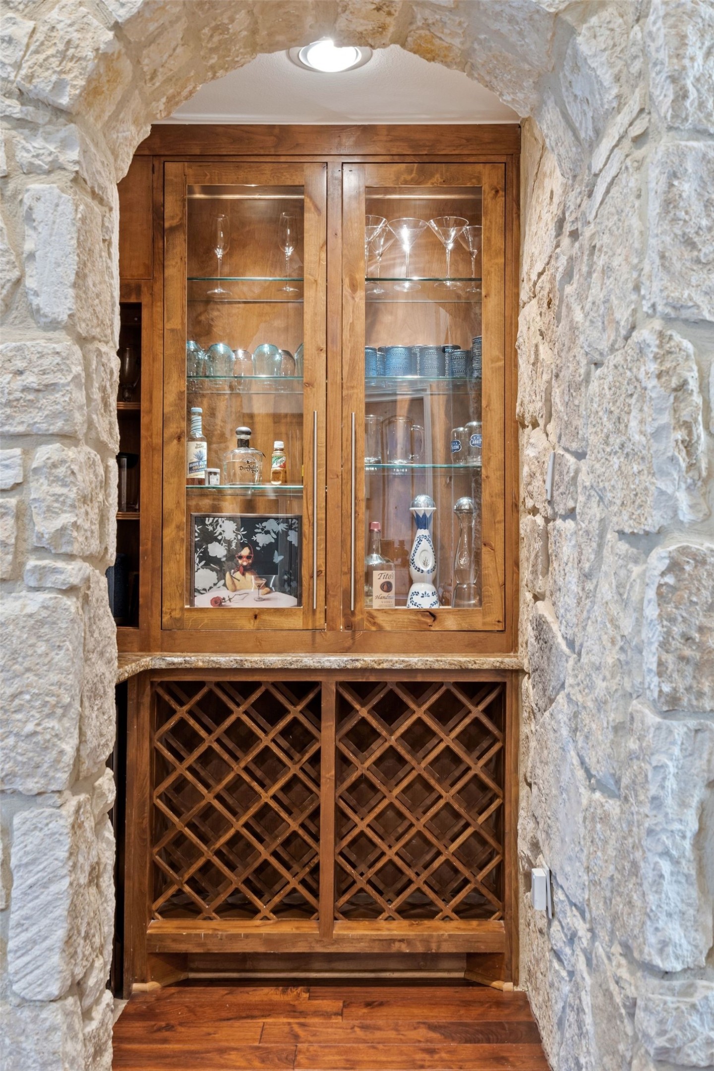 2002 Kinney Avenue, Unit B Austin, TX 78704 - Photo 8 of 34 Admire the custom cabinet wine bar, adorned with exquisite glass cabinets that add a touch of elegance to your entertaining space.