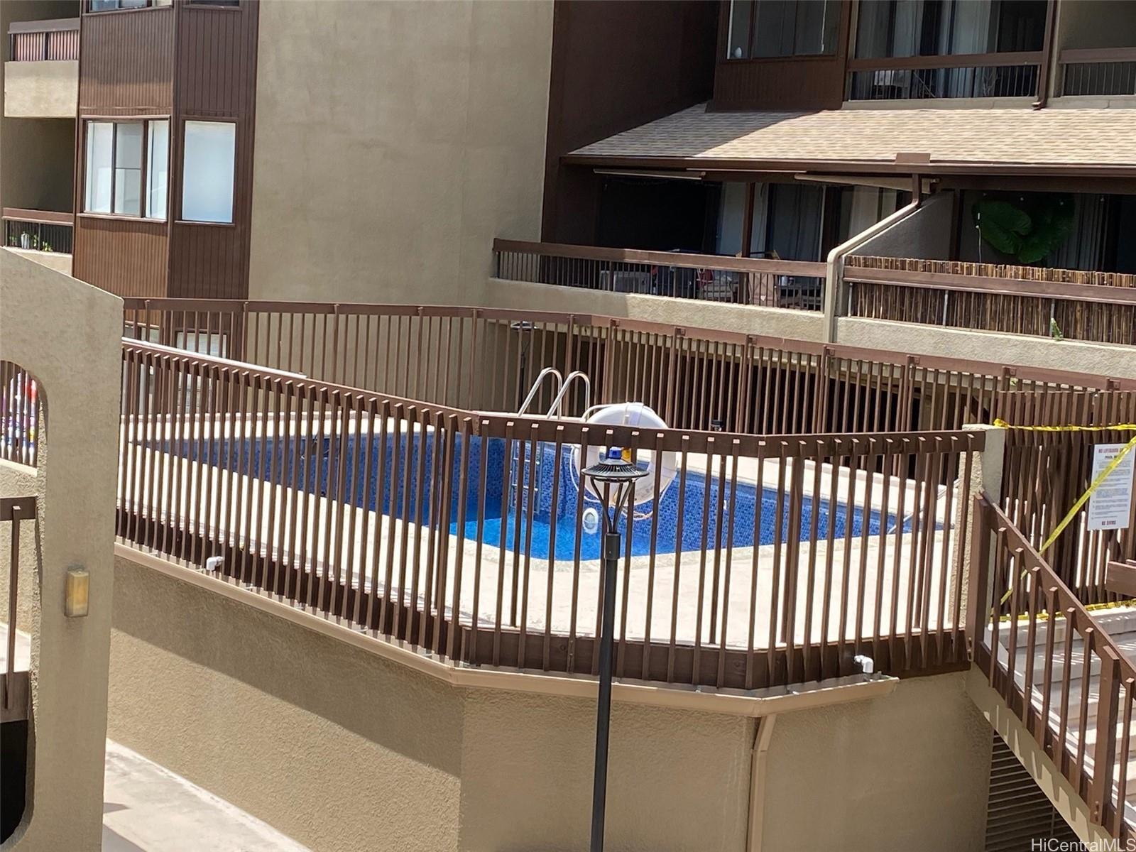 45-315 Lilipuna Road, Unit A306 Kaneohe, HI 96744 - Photo 19 of 19 a view of a balcony with wooden floor