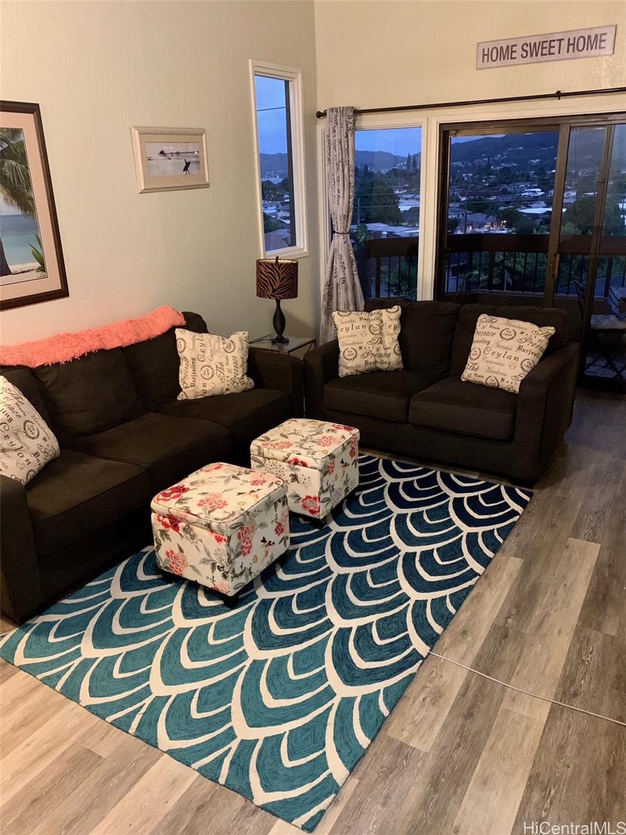 45-315 Lilipuna Road, Unit A306 Kaneohe, HI 96744 - Photo 2 of 19 a living room with furniture and a rug