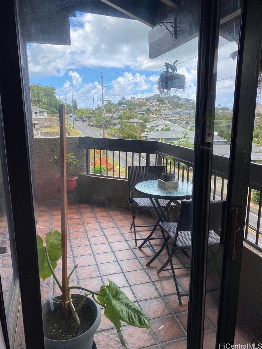 45-315 Lilipuna Road, Unit A306 Kaneohe, HI 96744 - Photo 3 of 19 a view of a chairs and table in the balcony