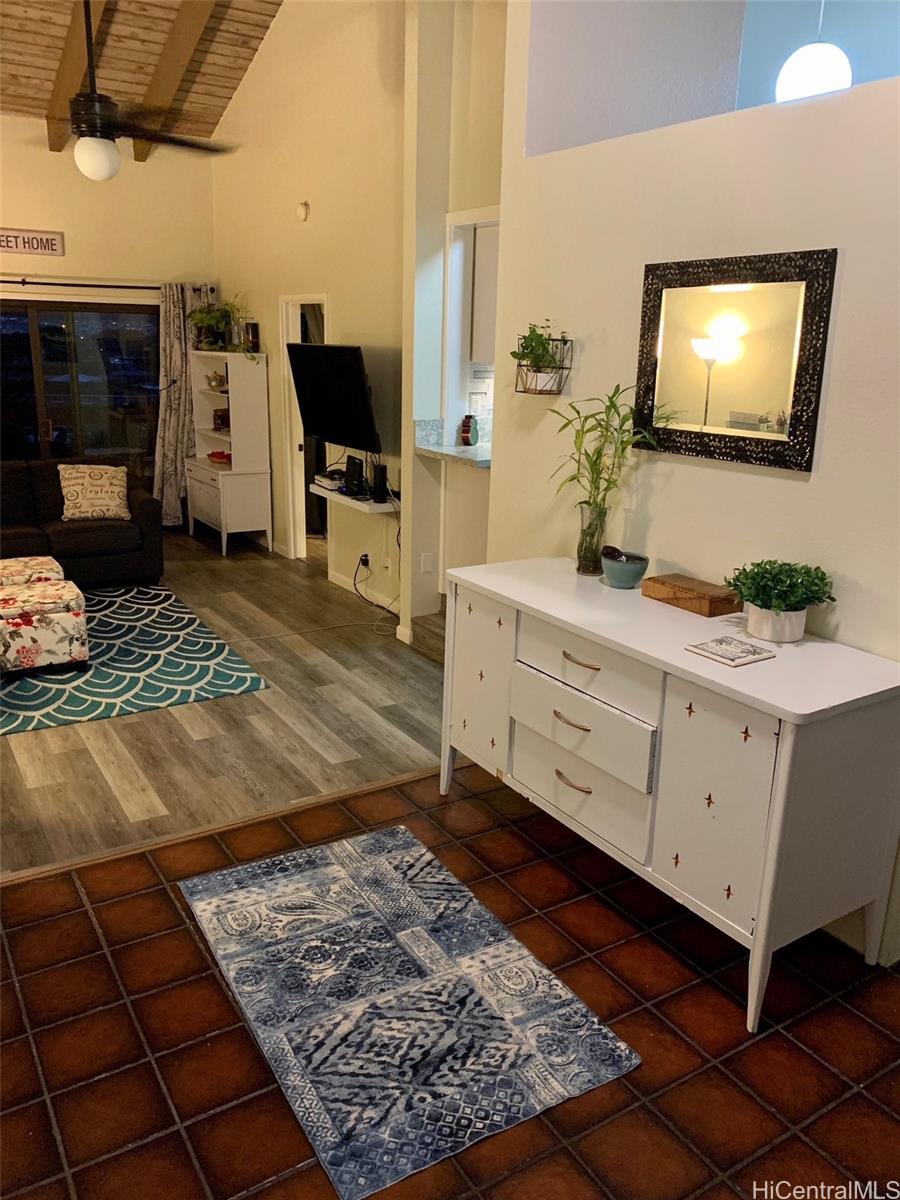 45-315 Lilipuna Road, Unit A306 Kaneohe, HI 96744 - Photo 4 of 19 a bathroom with a sink a mirror and shower