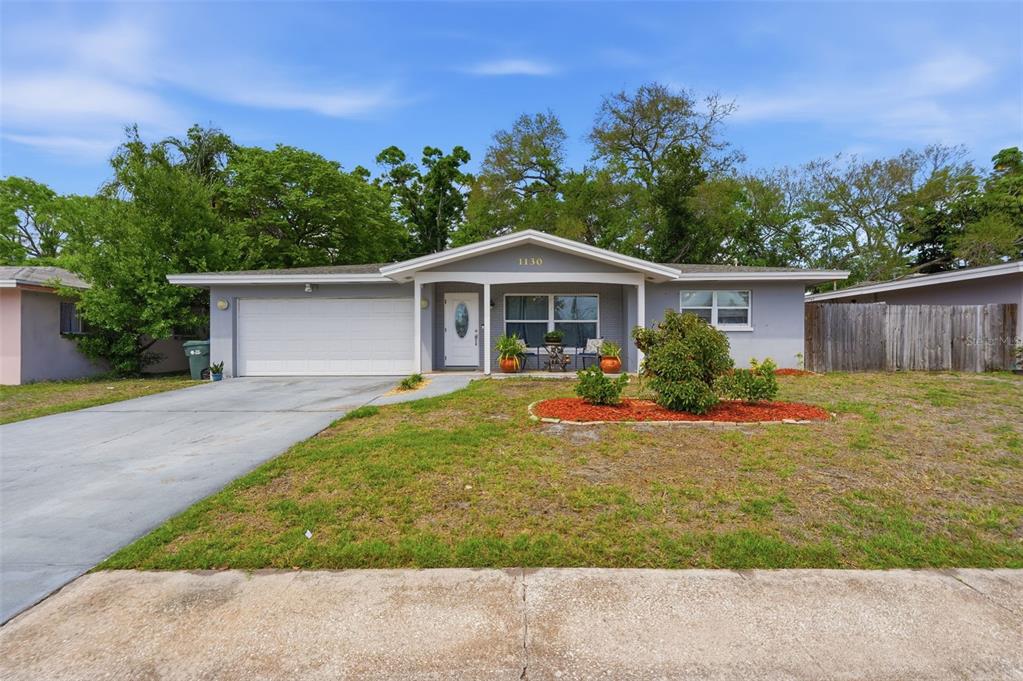 1130 8th Avenue Northeast Largo, FL 33770 - Photo 2 of 39 a front view of a house with a garden