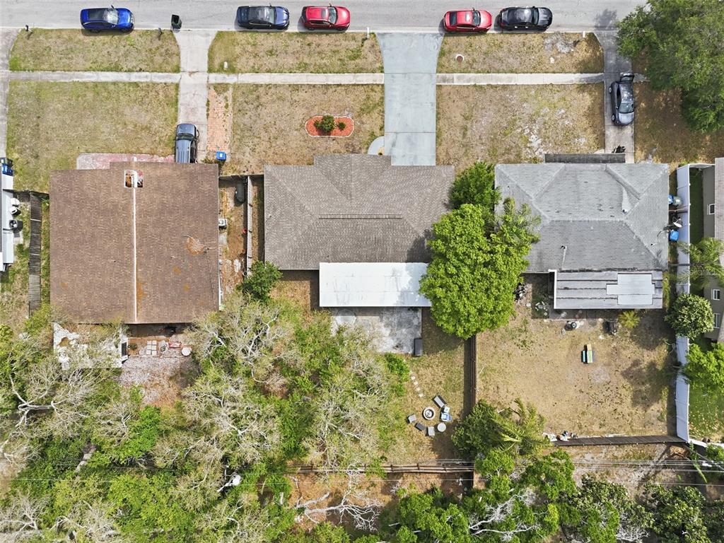 1130 8th Avenue Northeast Largo, FL 33770 - Photo 37 of 39 an aerial view of a house with a yard and a large tree