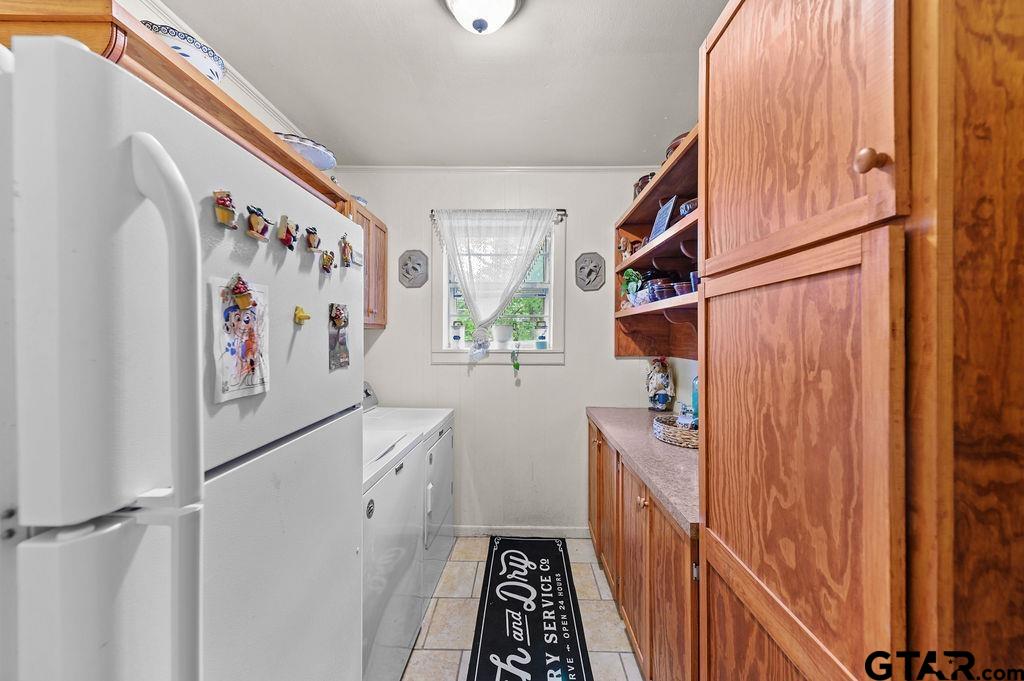 509 Tina Street Quitman, TX 75783 - Photo 13 of 17 a kitchen with a refrigerator and a stove