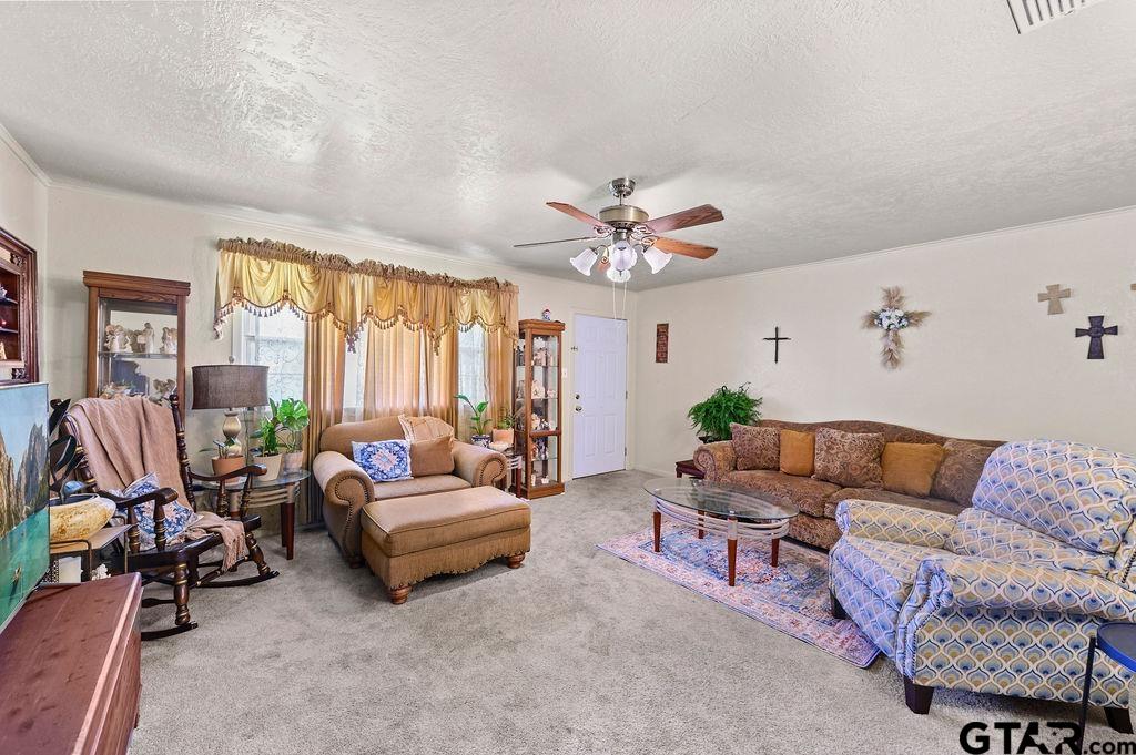 509 Tina Street Quitman, TX 75783 - Photo 4 of 17 a living room with furniture and a large window