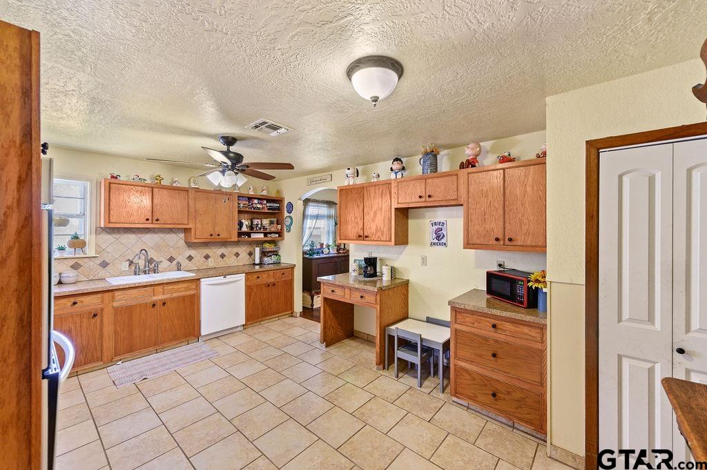 509 Tina Street Quitman, TX 75783 - Photo 8 of 17 a kitchen with cabinets and chairs