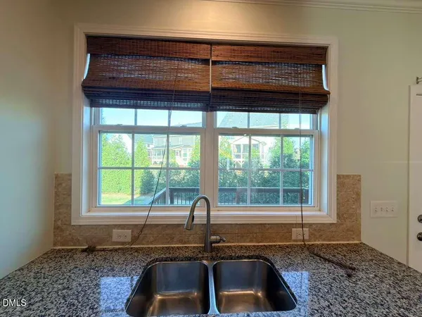 a kitchen with a sink and a window