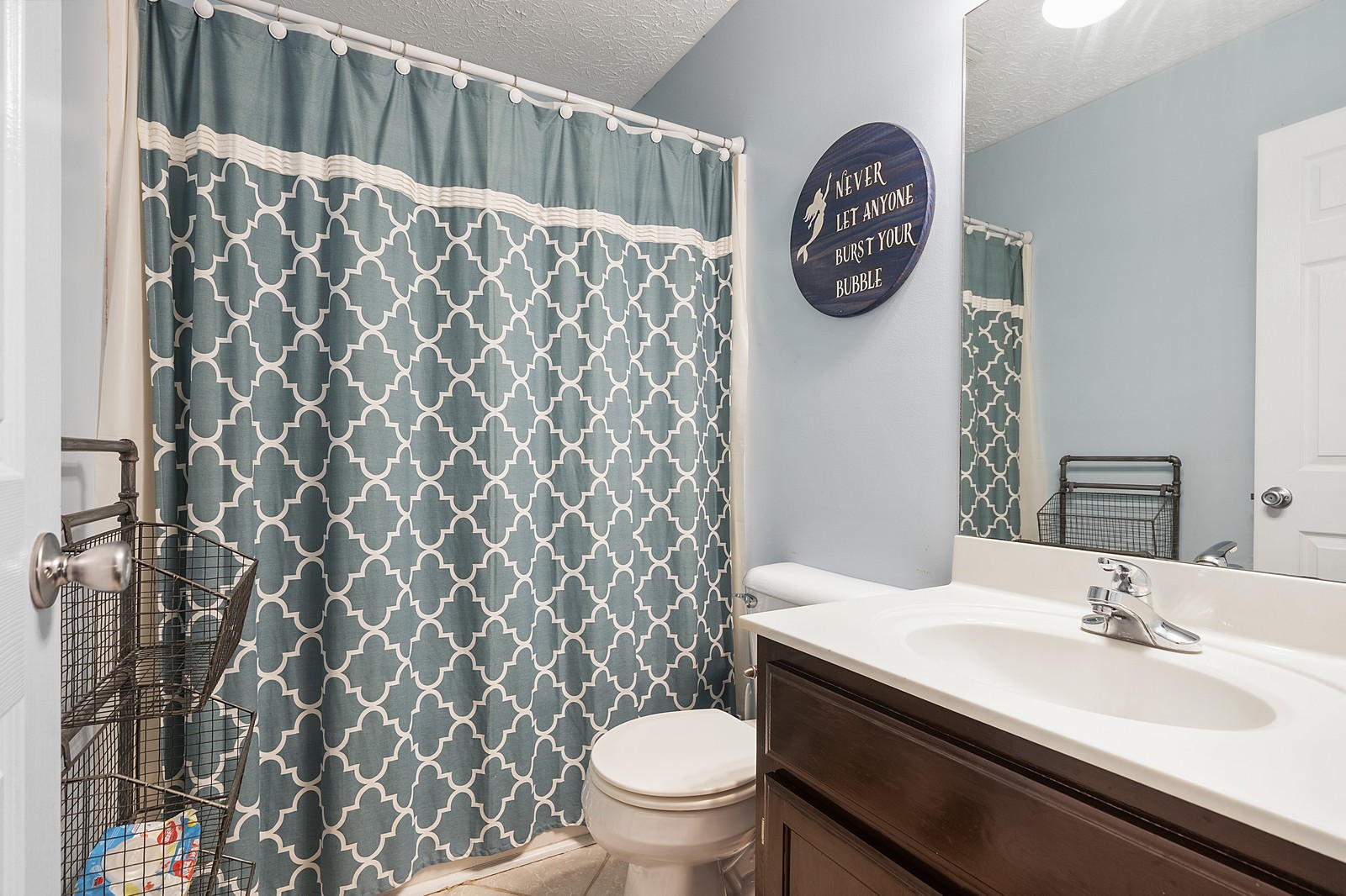 4415 Matthews Road Cedar Hill, TN 37032 - Photo 16 of 19 a bathroom with a toilet a sink and a shower curtain