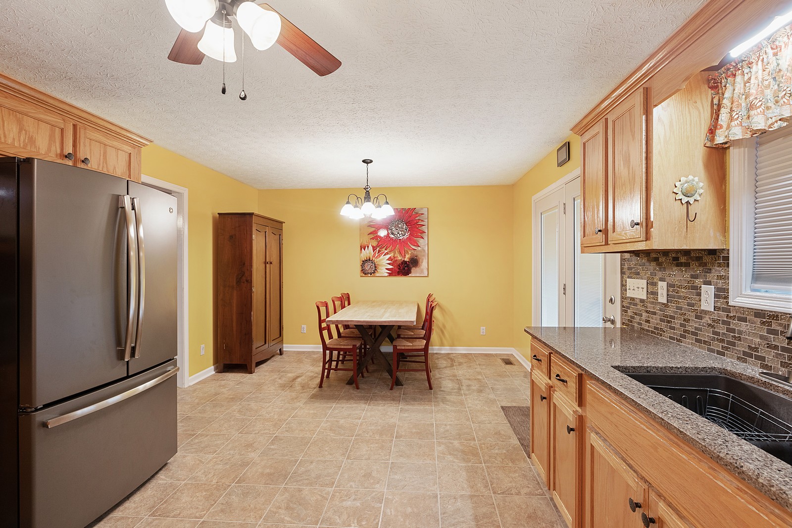 4415 Matthews Road Cedar Hill, TN 37032 - Photo 9 of 19 a kitchen with stainless steel appliances granite countertop a refrigerator and a sink