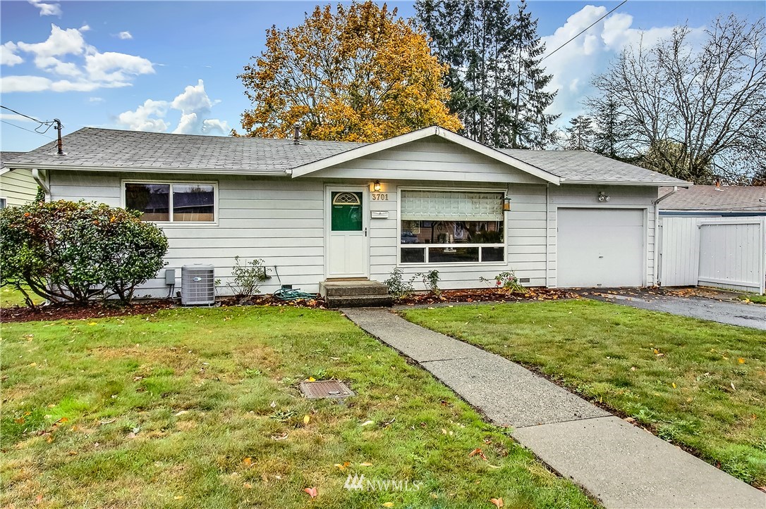 3701 Northeast 9th Street Renton, WA 98056 - Photo 1 of 13 a front view of a house with garden