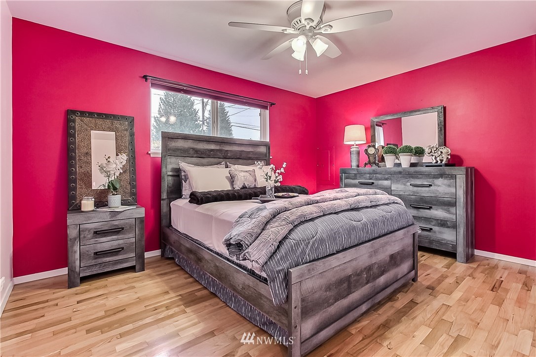 3701 Northeast 9th Street Renton, WA 98056 - Photo 10 of 13 a bedroom with a bed and wooden floor