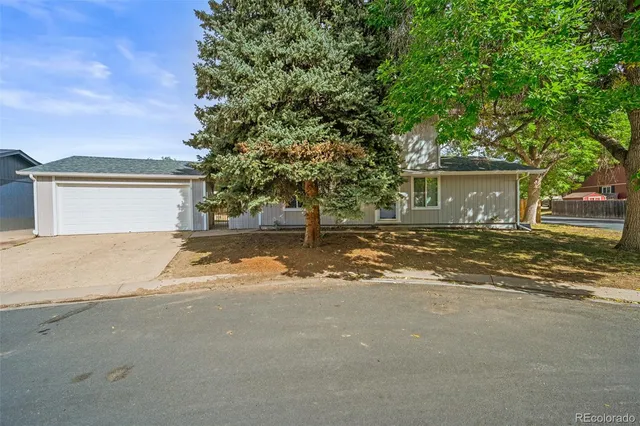 a view of a house with a outdoor space and yard