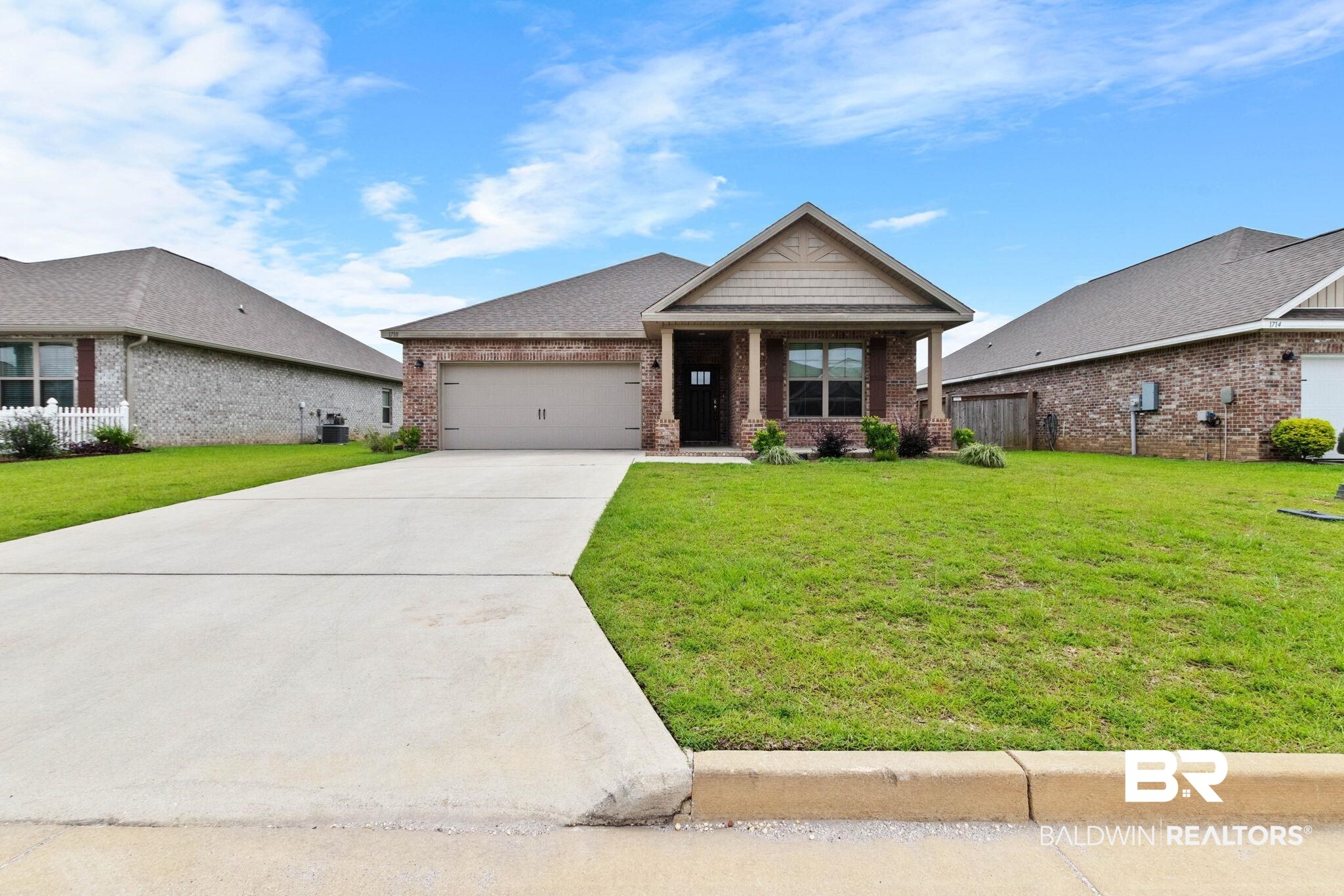 1710 Grouse Street Foley, AL 36535 - Photo 2 of 76 Brick exterior with a shingle roof and covered front entry