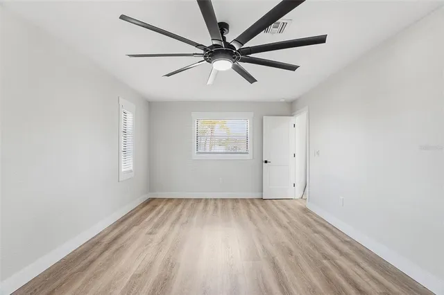 a bathroom with a double vanity sink mirror and toilet