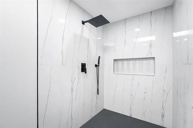 a kitchen with stainless steel appliances granite countertop a sink stove and microwave