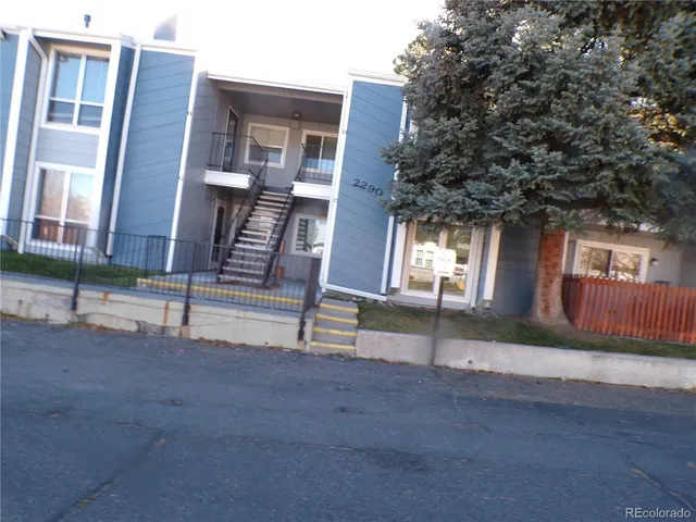 a view of house with yard