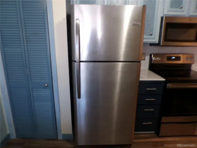 a white toilet sitting next to a sink