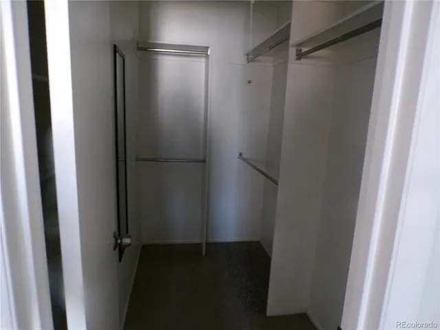 a view of a balcony with chair and wooden floor