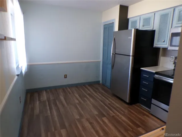 a kitchen with a refrigerator stove and sink