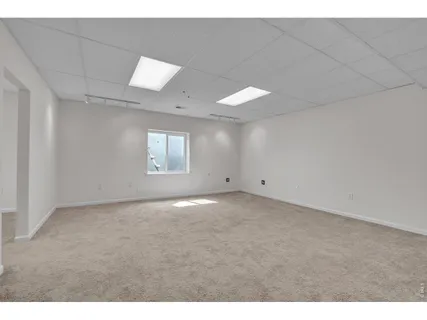 a view of an empty room and a window