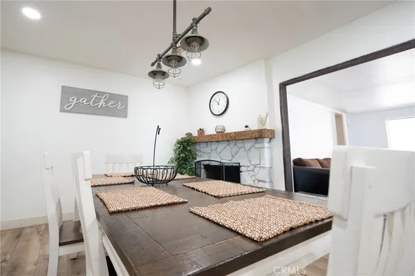 a view of a kitchen with a stove wooden floor and a refrigerator