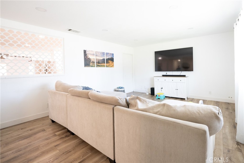 822 East Virginia Street Rialto, CA 92376 - Photo 16 of 20 a living room with furniture and a flat screen tv
