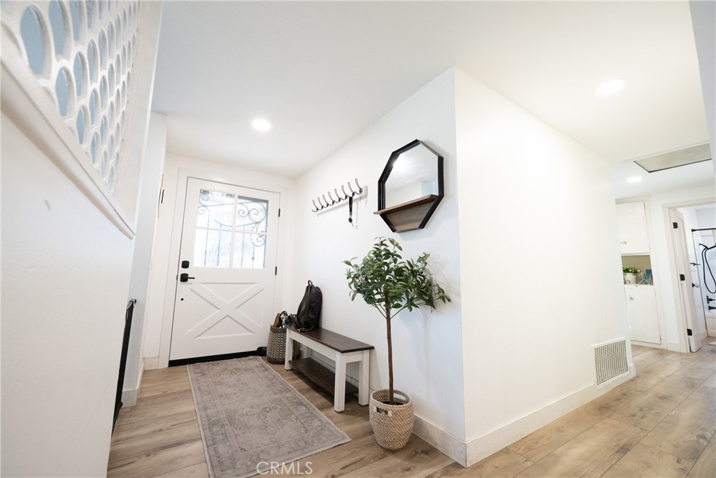 822 East Virginia Street Rialto, CA 92376 - Photo 2 of 20 a living room with furniture and a potted plant
