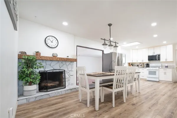 a view of a dining room kitchen and a fireplace