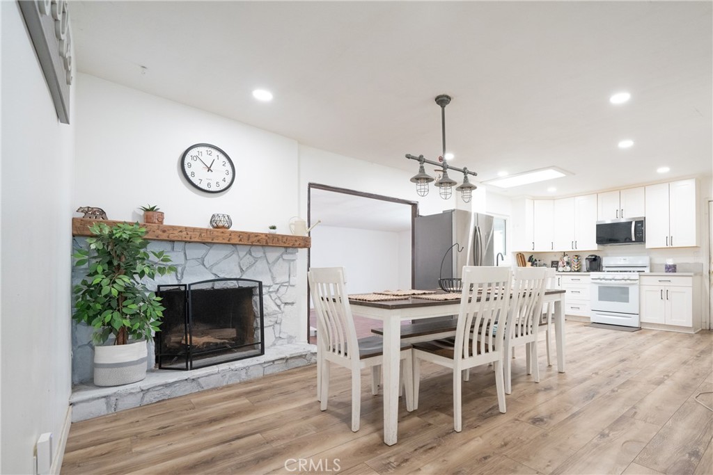 822 East Virginia Street Rialto, CA 92376 - Photo 5 of 20 a view of a dining room kitchen and a fireplace
