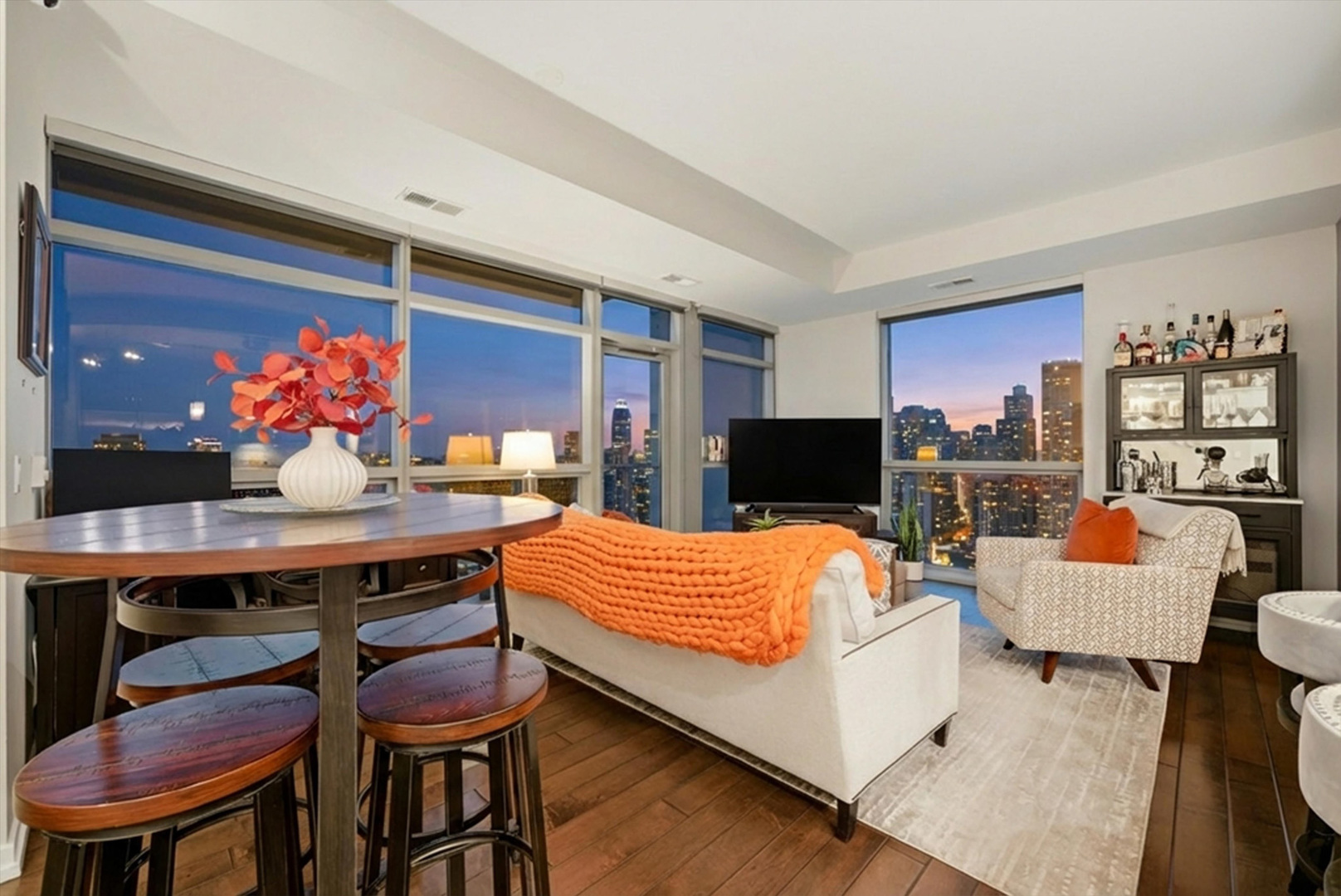 303 West Ohio Street, Unit 3502 Chicago, IL 60654 - Photo 17 of 41 a room with a table chairs and a living room