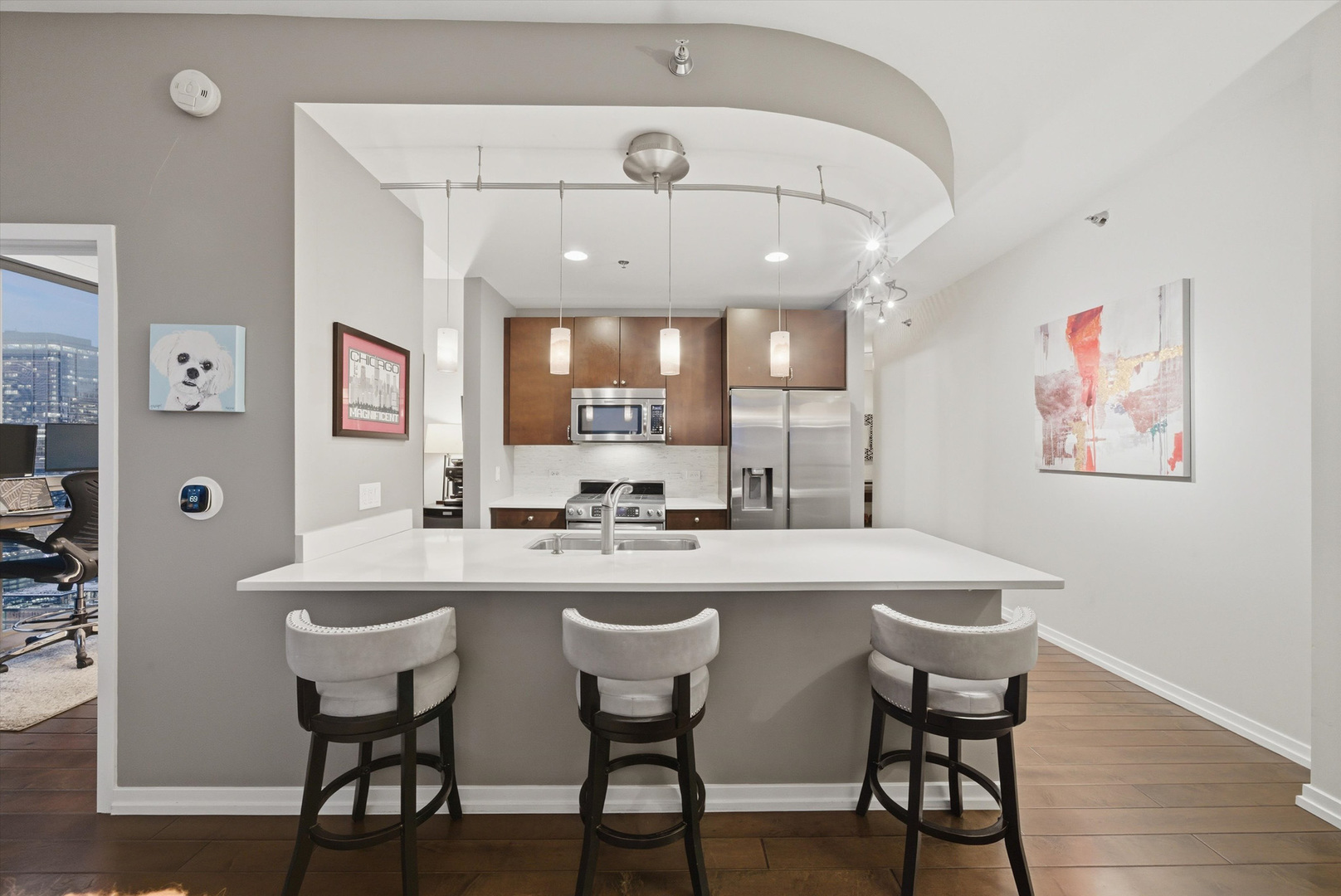 303 West Ohio Street, Unit 3502 Chicago, IL 60654 - Photo 2 of 41 a kitchen with a dining table and chairs