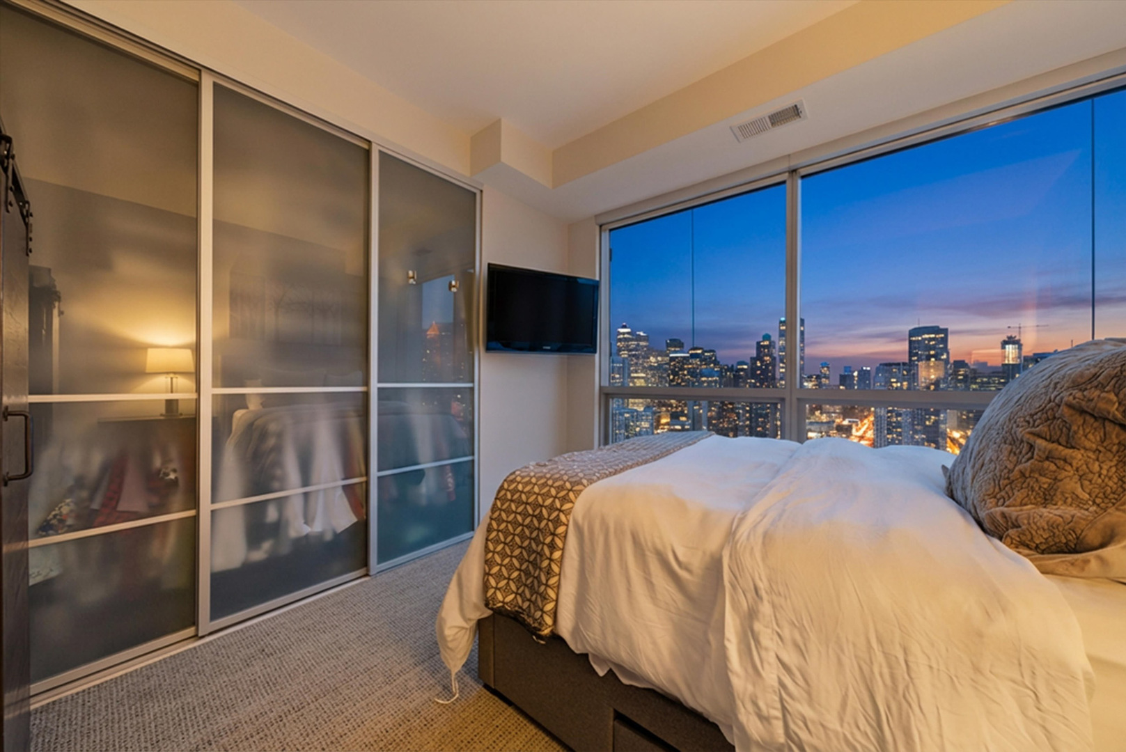 303 West Ohio Street, Unit 3502 Chicago, IL 60654 - Photo 23 of 41 a bed room with a bed and a television