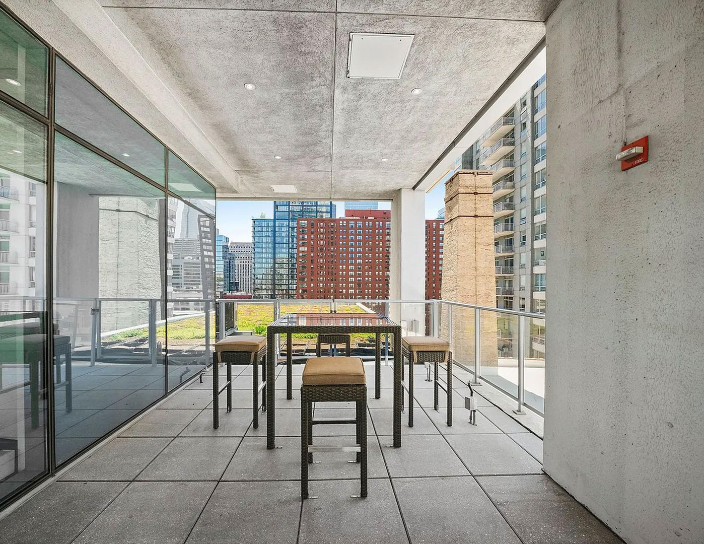 303 West Ohio Street, Unit 3502 Chicago, IL 60654 - Photo 36 of 41 a dining room with furniture and a floor to ceiling window