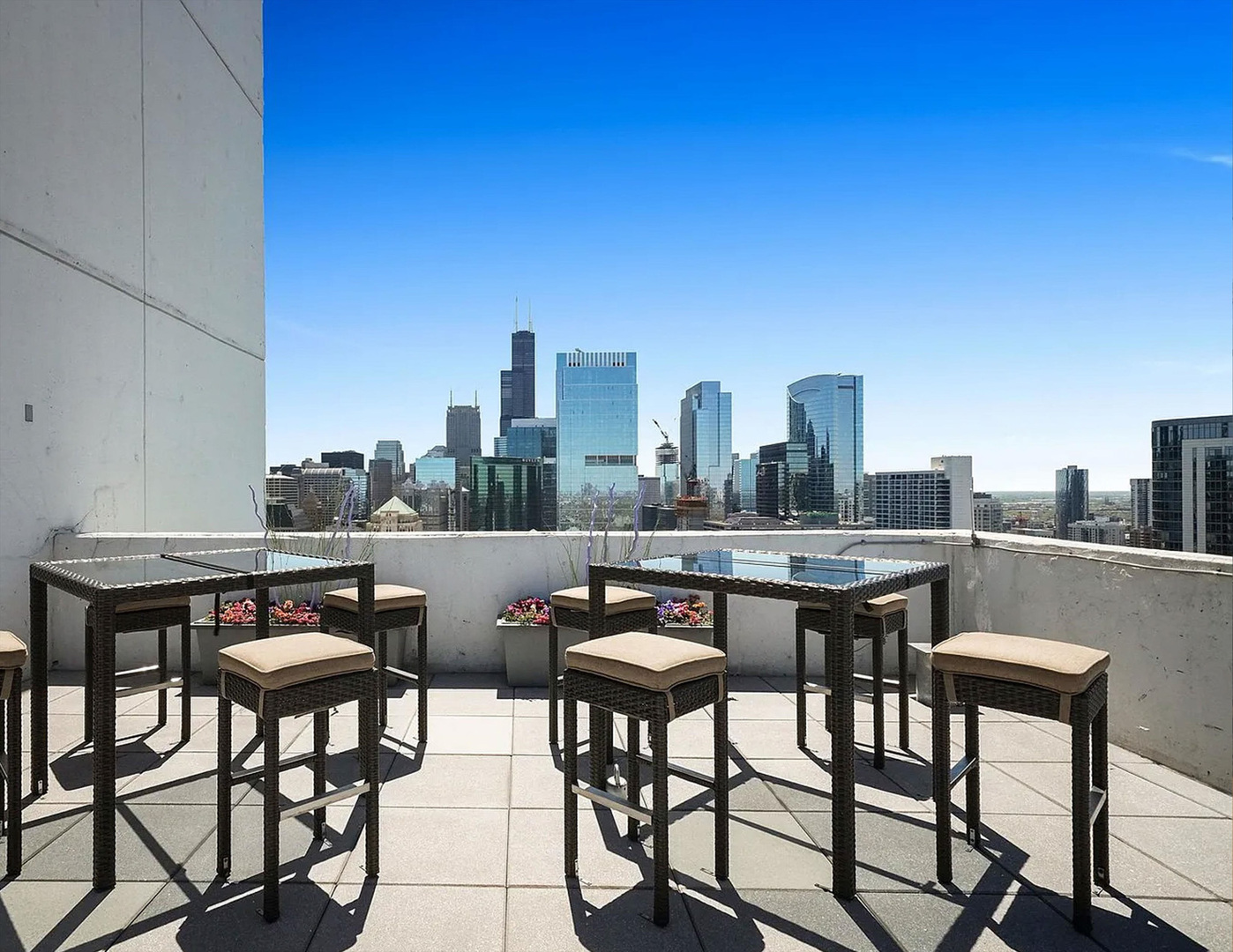 303 West Ohio Street, Unit 3502 Chicago, IL 60654 - Photo 38 of 41 a view of a terrace with furniture and a kitchen